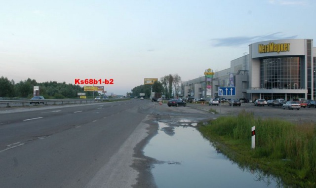 Щит 12x3,  Поворот на с.Ходосіївка, навпроти торг. центру "Мегамаркет в Ходосіївці"; 23+850 ліворуч