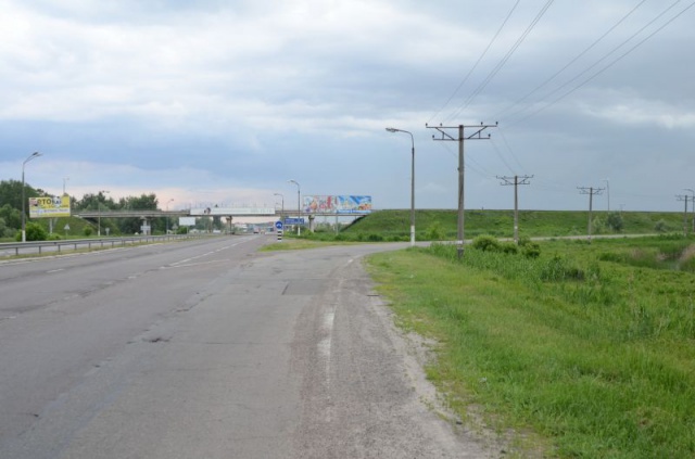 Щит 12x3,  Перед поворотом на c. Креничі, Ходосіївку, 25км+100 праворуч